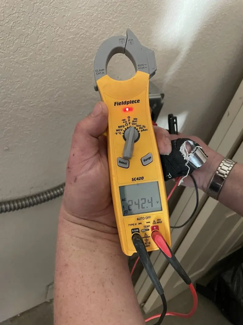 Voltage testing with clamp meter during Generator Installation in Lacombe